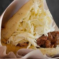 Arepa La Pelua · The Arepa Pelúa. A mixture of our juicy shredded meat accompanied by delicious intense chees...