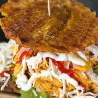 Patacon De Pollo · Chicken Patacon - Green plantain sandwich filled with Shredded Chicken, lettuce, tomato, boi...