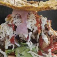 Patacon De Pernil · Roast Pork Patacon - Green plantain sandwich filled with Roast Pork, lettuce, tomato, boiled...