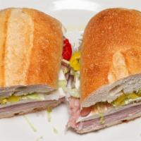 Traditional Sandwich · Imported ham, Genoa salami, fresh mozzarella, sweet, and hot peppers, lettuce, tomato, red o...