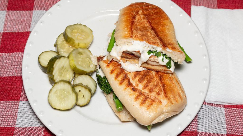 Maestro Panini · Grilled or breaded chicken cutlet, fresh mozzarella, broccoli rabe, and extra virgin olive oil.