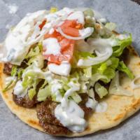 Gyro · Lettuce, tomatoes, onions and white sauce.