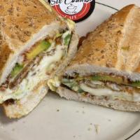 Chicken Cutlet Sandwich · Delicious sandwich made with Breaded cutlet with sauce and cheese. Topped with lettuce, toma...