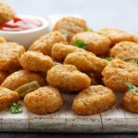 Cheddar Jalapeño Poppers · Juicy jalapeño poppers breaded and filled with cheese and fried to golden perfection.