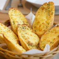 Garlic Bread · Italian bread topped off with extra virgin olive oil, garlic, olive oil, and parmesan cheese.