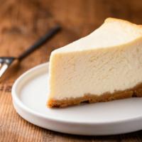 The Cheesecake · Rich and creamy New York-style cheesecake baked inside a honey graham crust.