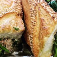 Roast Pork & Broccoli Rabe · Herb & Garlic crusted Pork loin with sautéed Broccoli Rabe & Provolone on a hero bread.