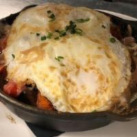 -Potato Skillet · Home fries, cheddar, peppers, onions, and fried eggs.