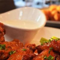 -Jumbo Chicken Wings · Tossed in choice of spicy buffalo sauce or smoky Bbq.