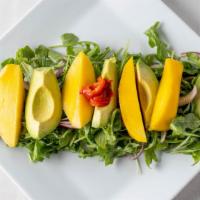 Mango Avocado Salad · With baby arugula and orange citrus dressing.