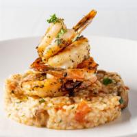 Grilled Shrimp · Wild mushroom risotto and tomato confit.