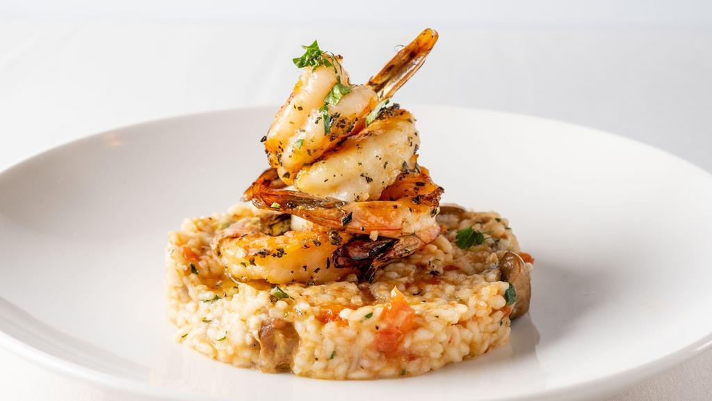 Grilled Shrimp · Wild mushroom risotto and tomato confit.