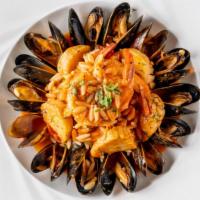 Seafood Orzo · With Prince Edward Island mussels, scallops, and shrimp in a fresh tomato sauce flamed with ...
