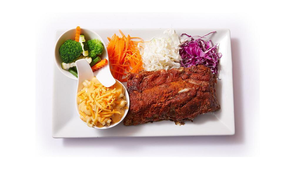 Bbq Baby Back Ribs · Includes a salad, one BBQ side and a drink. Coated with Ae's signature dry rub. slow smoked with mesquite wood. Served with your choice of sauce on the side.