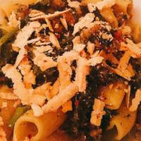 Rigatoni With Broccoli Rabe · Rigatoni with broccoli rabe, sweet sausage, and spicy pecorino.