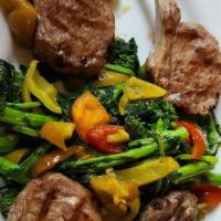 Lamb Chops · Grilled lamb chops and served with broccoli rabe.