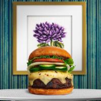 Return Of The Jalapeno Burger · Seasoned homemade vegan patty topped with melted vegan cheese, jalapenos, lettuce, tomato, o...