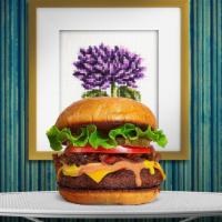 A Vegan Classic Hope Burger · Seasoned homemade vegan patty topped with lettuce, tomato, onion, and pickles. Served on a v...