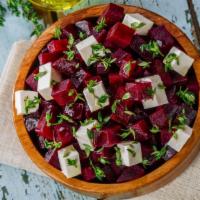 Beet Salad · Fresh red beets with scallions, dill, onions & hummus spread.