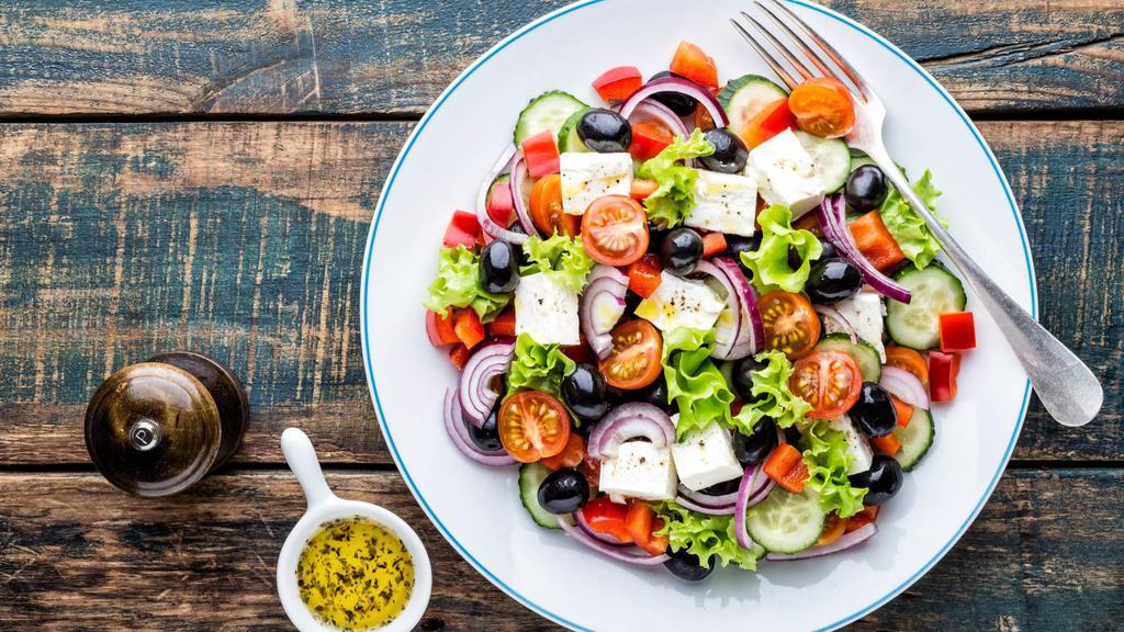 Greek Salad · Authentic and delicious Greek salad prepared with vine ripe tomatoes.