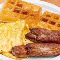 Waffles, 2 Eggs, Bacon, Ham Or Sausage · Includes Coffee or Orange Juice