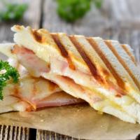 Il Toast Panini · Fresh hot panini with Boar's Head ham, Swiss cheese, crispy bacon, sliced pickles, and deli ...