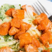 Buffalo Chicken Salad · Fresh salad with crispy romaine lettuce, Buffalo chicken, pepper jack cheese, celery, tortil...