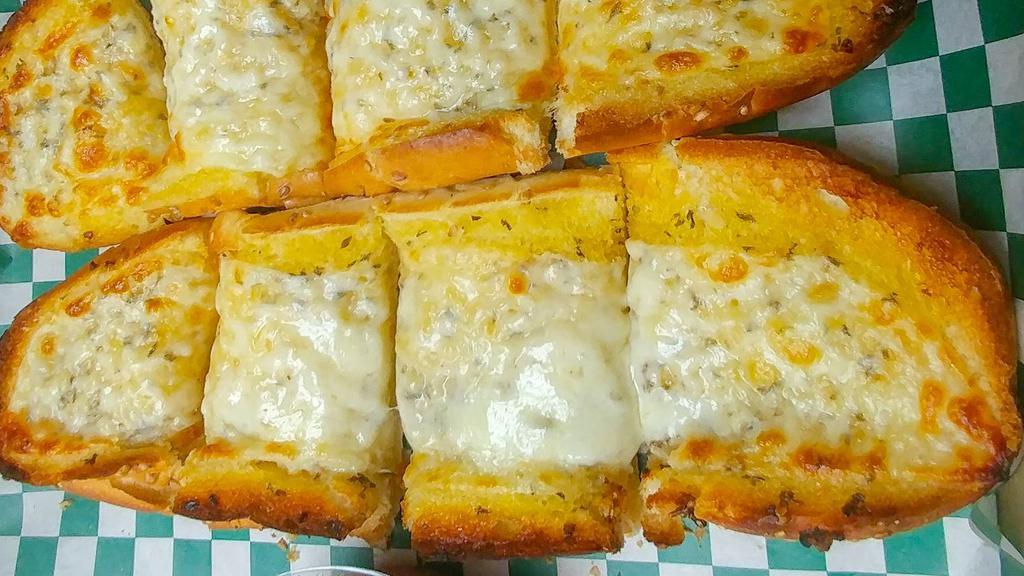 Garlic Bread With Cheese · Made fresh and seasoned with garlic, spice, parmesan cheese, and covered with provolone cheese. Served with a side order of pizza sauce.