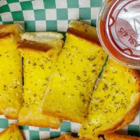 Garlic Bread · Made fresh and seasoned with garlic, spice, and parmesan cheese. Served with a side order of...