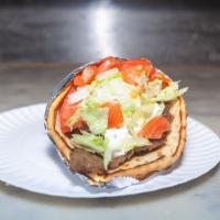 Lamb Gyro · Juicy lamb flame-roasted on a vertical rotisserie.