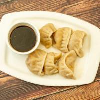 Pork Dumplings · Six pieces. Pork, vegetables, fresh herbs, and soy ginger sauce.