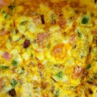 Western Omelette · Three eggs. Green peppers, ham, and onions.