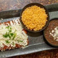 Enchiladas Plate · Three corn tortillas stuffed with rolled in enchilada sauce, topped off with Mexican sour cr...