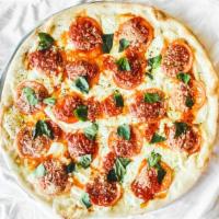 Margherita Pizza · Fresh mozzarella cheese, fresh tomato, garlic, basil and sauce.