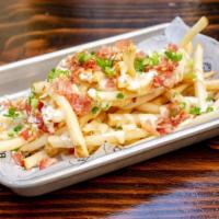 Loaded Fries · Shredded cheddar, scallions, bacon bits, ranch dressing.