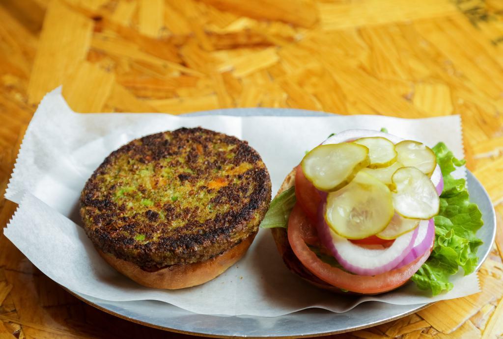 Classic 100% Veggie Burger · All vegan patty made of carrots, onions, string beans, oat brans, soybeans, zucchini, peas, broccoli, corn, spinach, red pepper, parsley. Select your toppings.