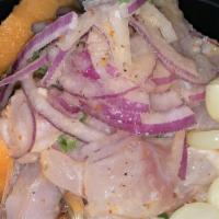 Chicharron De Pescado · Deep fried chunks of fish served with yucca and salsa criolla