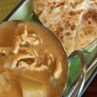 Roti Canai · Wheat Indian style flatbread with potato and chicken massaman curry sauce.