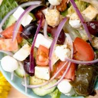 Greek Salad · Vegetarian. Mix green, feta, olives, grape leaves, onions, tomatoes.