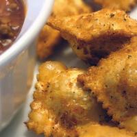 Fried Ravioli · 8 pieces.  Served with Tomato Sauce