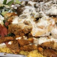 Chicken & Lamb Over Rice With Salad · A mix of chicken and lamb gyro served with basmati rice and lettuce, tomatoes, onions, pickl...