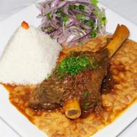 Seco Norteno · Slowly cooked lamb stew in aji panka sauce, served with rice and Peruvian canario beans.