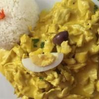 Aji De Gallina · Shredded chicken in a spicy yellow pepper creamy sauce, hard-boiled egg, potatoes and rice.