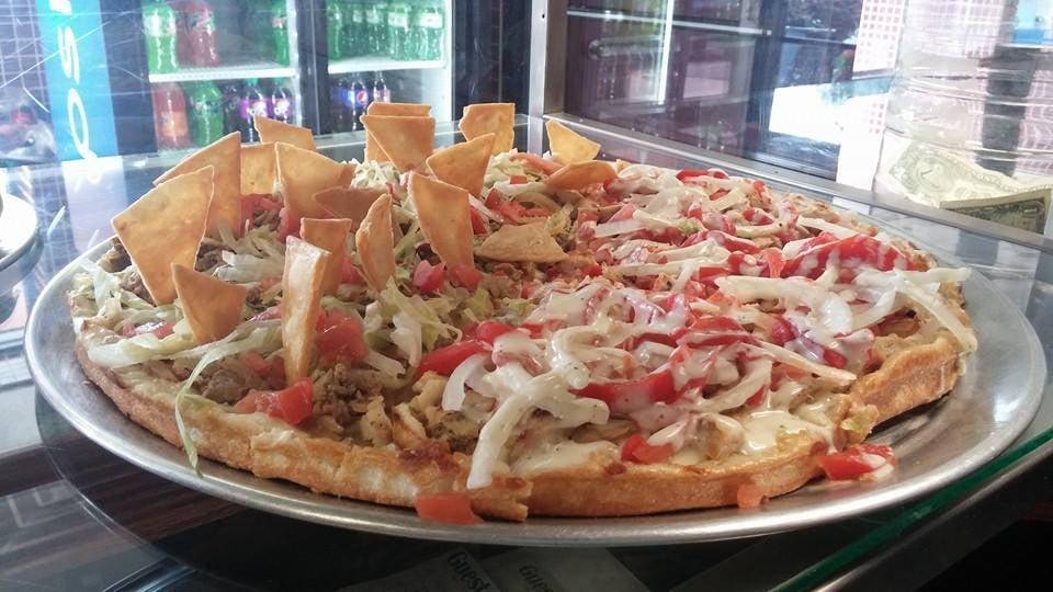 Taco Pizza · Seasoned ground beef with lettuce, tomato & cheddar cheese.