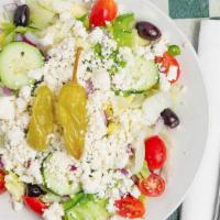 Greek · Iceberg, feta, cherry tomatoes, cucumbers, pepperoncini, kalamata olives, green olives and r...