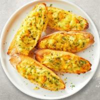 Cheesy Garlic Bread  · (Vegetarian) Housemade bread toasted and garnished with butter, garlic, mozzarella cheese, a...