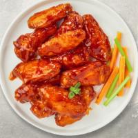Buffalo Chicken Wings · Ten pieces of fresh chicken wings breaded, fried until golden brown, and tossed in buffalo s...