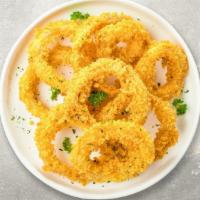 The Golden Onion Rings · (Vegetarian) Sliced onions dipped in a light batter and fried until crispy and golden brown.