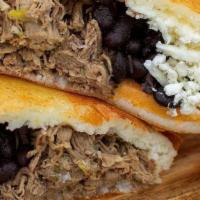 Pabellon Empanada · Shredded beef, sweet plantains, black beans and cheese.