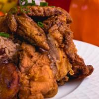 Fried Chicken · Meals are served with a side of steamed vegetables, fried plantains, a choice of plain rice ...